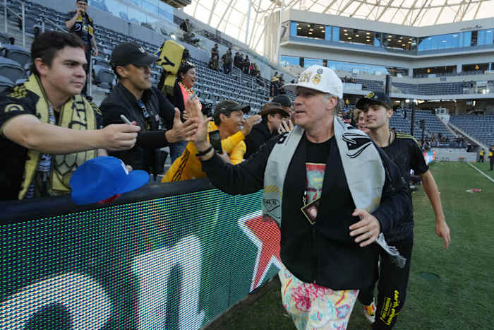 Actor Will Ferrell high fives fans after LAFC’s win
